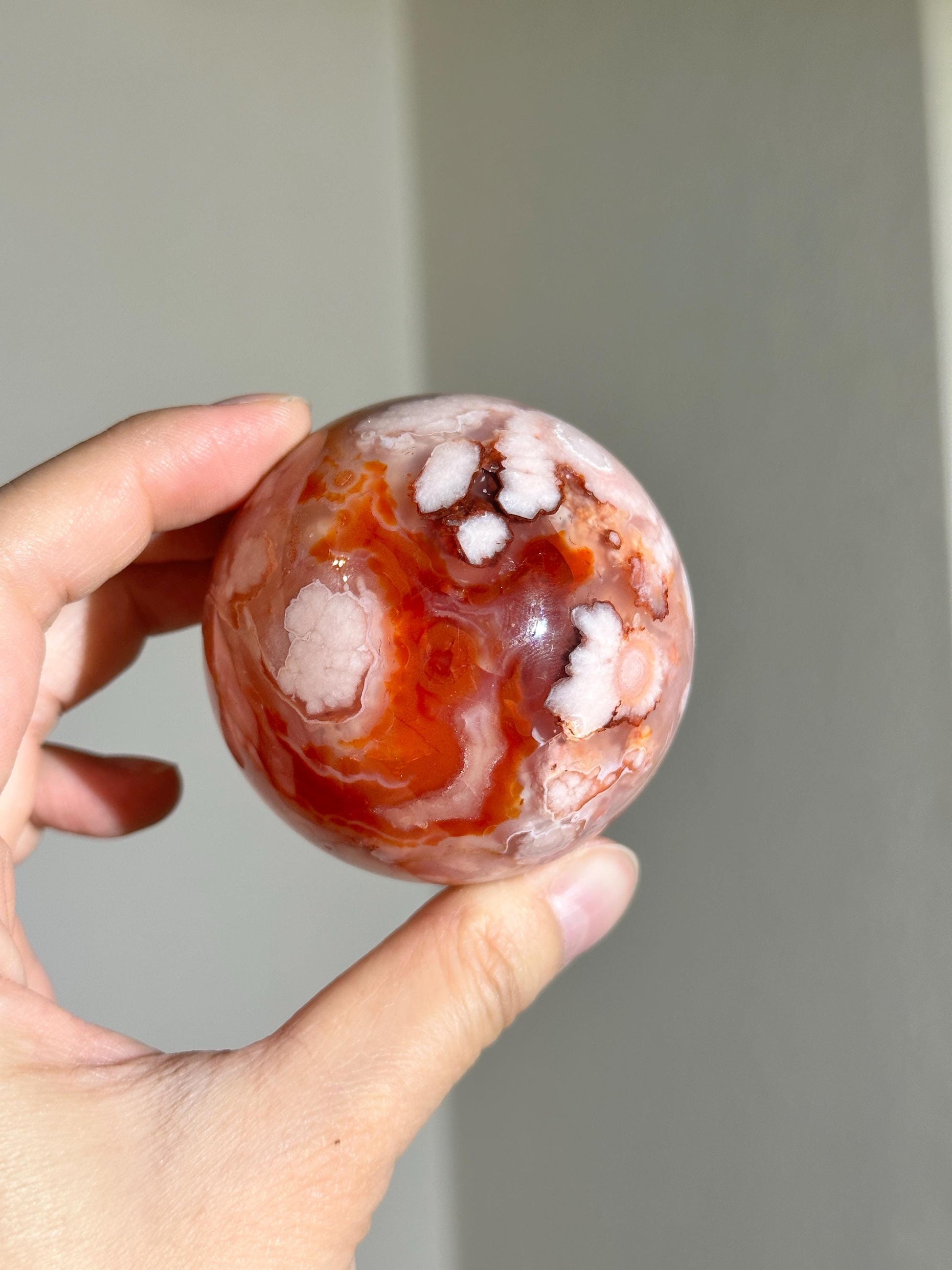 carnelian flower agate sphere with blossoming plumes