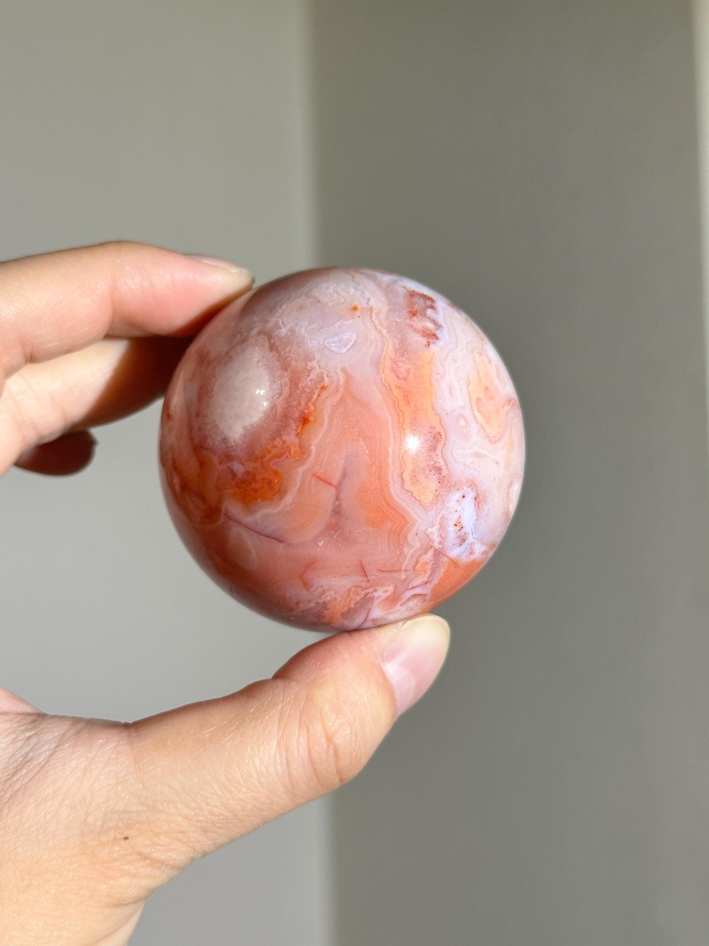 carnelian flower agate sphere with blossoming plumes