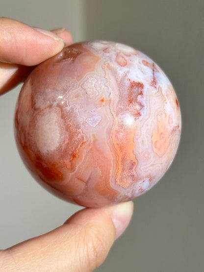 carnelian flower agate sphere with blossoming plumes