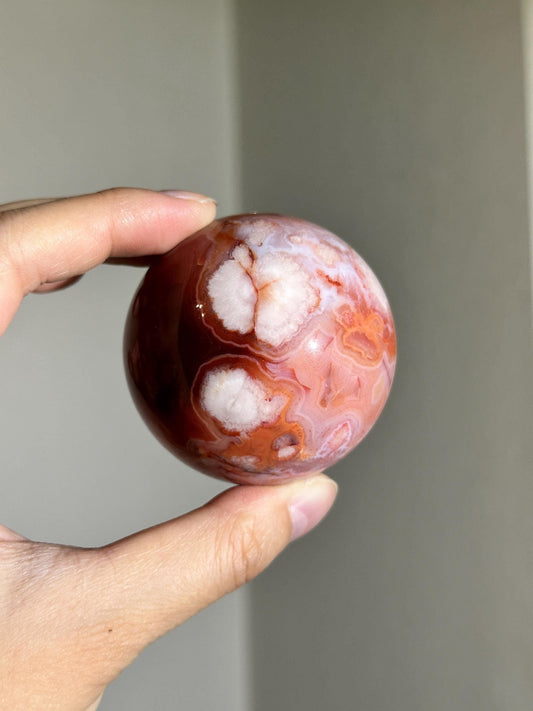 carnelian flower agate sphere with blossoming plumes