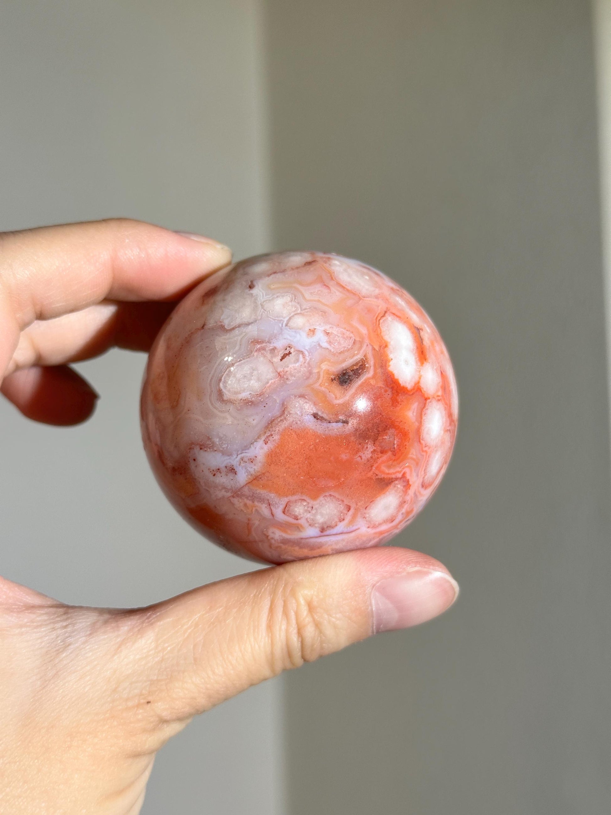 carnelian flower agate sphere with blossoming plumes