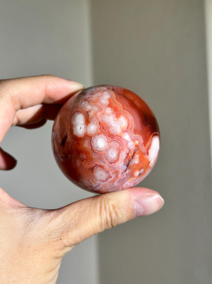 carnelian flower agate sphere with blossoming plumes