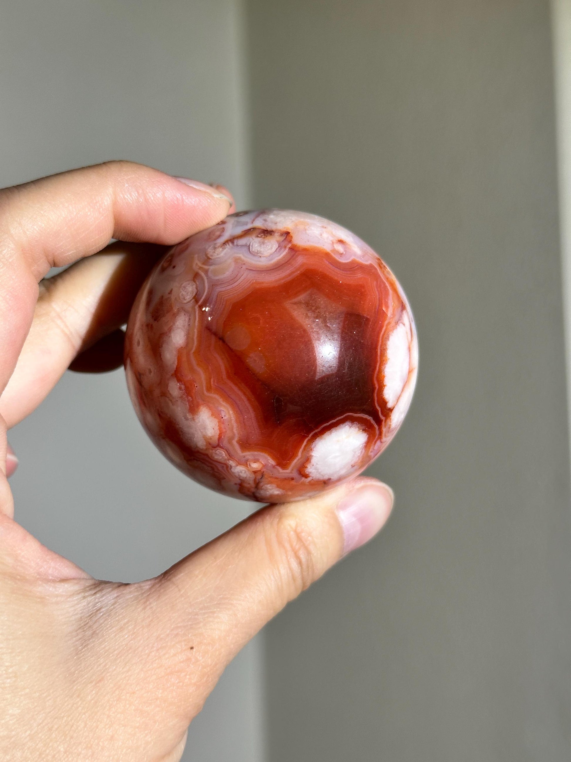 carnelian flower agate sphere with blossoming plumes